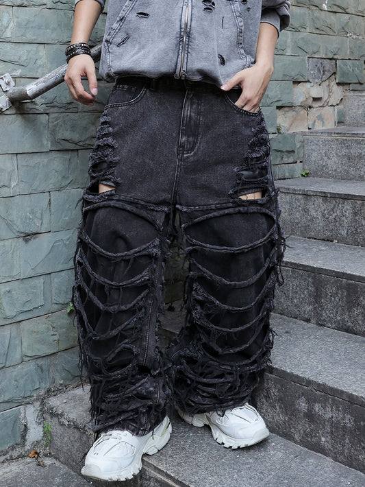 Men's black jeans. With a design of (ripped holes) and tassels. In a street trend style.